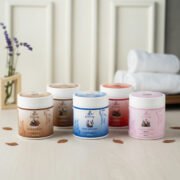 freepik__group-of-sugar-body-scrubs-arranged-on-a-light-neu__84599